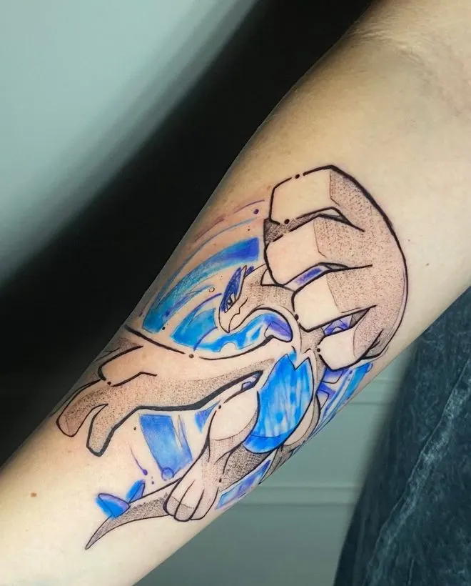 Tatuagem do Lugia (Pokémon) com detalhe em azul, antebraço, uma sessão
